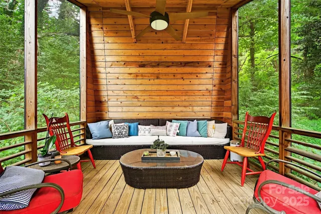 a view of a backyard with table and chairs and plants