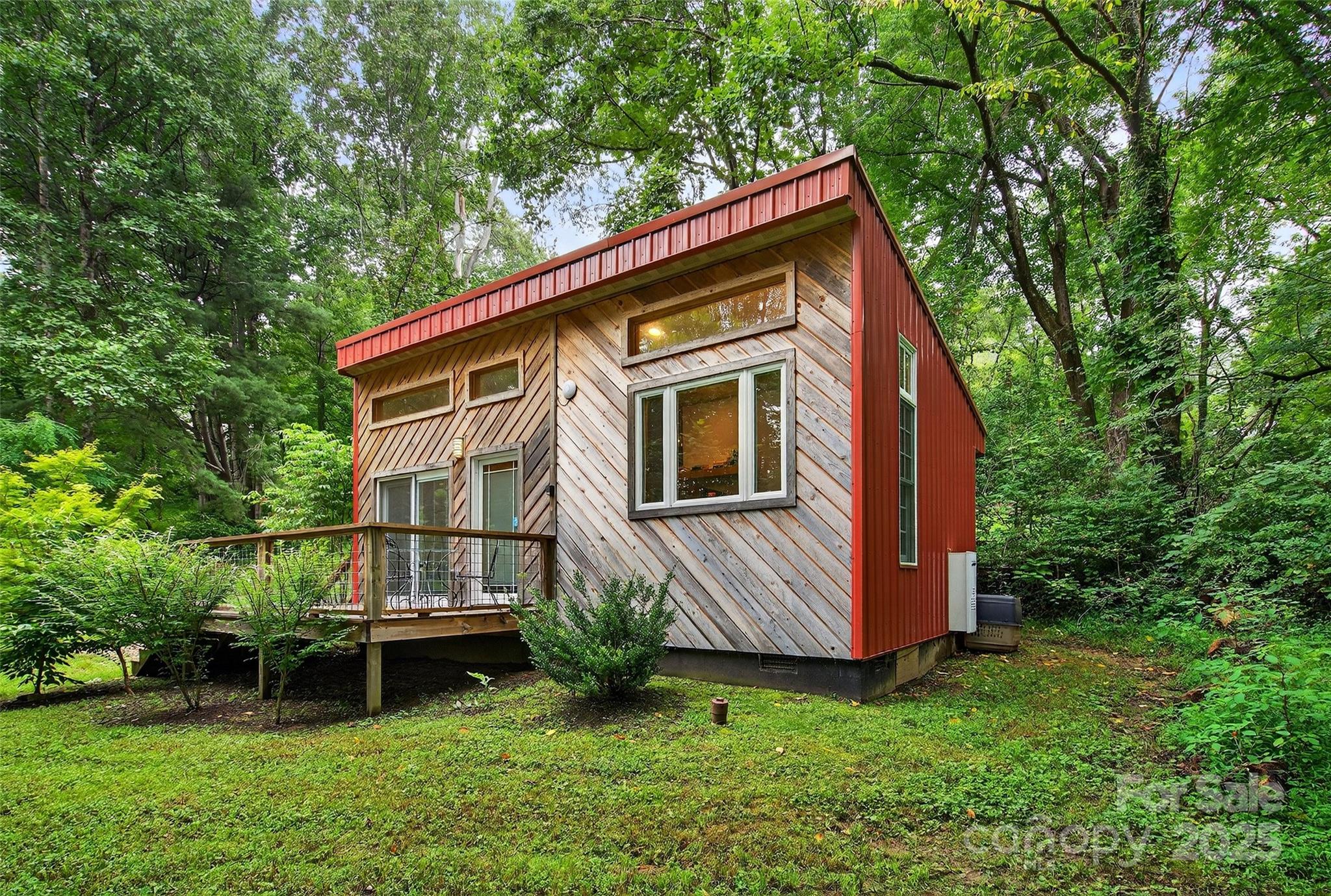 450 Lakey Gap Road Black Mountain, NC 28711 - Photo 38 of 48 a backyard of a house with table and chairs