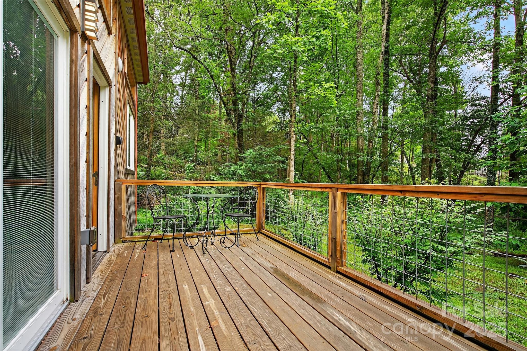 450 Lakey Gap Road Black Mountain, NC 28711 - Photo 40 of 48 a view of a balcony with wooden floor