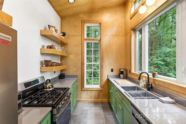 a bedroom with a bed a couch and a window