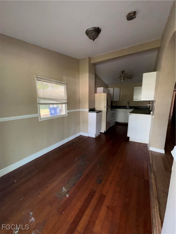 3724 Richard Road North Fort Myers, FL 33903 - Photo 6 of 17 a kitchen with a refrigerator and a stove top oven