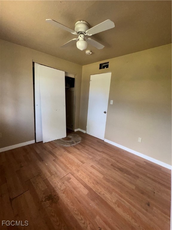 3724 Richard Road North Fort Myers, FL 33903 - Photo 10 of 17 an empty room with wooden floor and ceiling fan