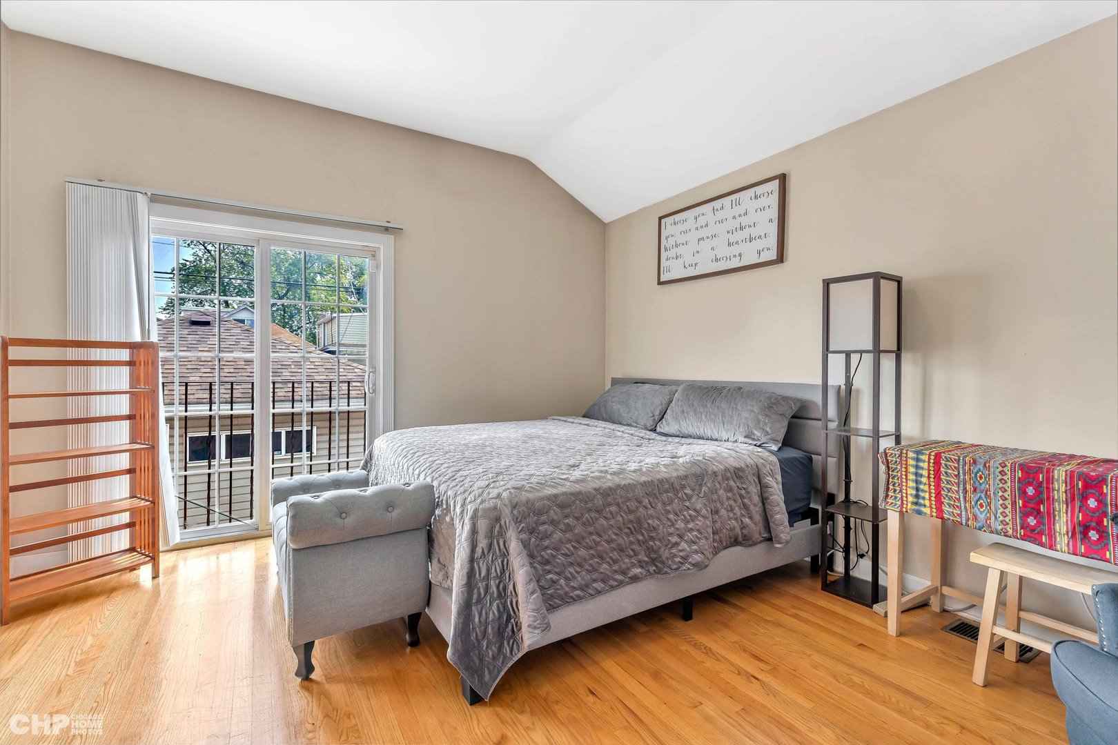 2931 North Rutherford Avenue Chicago, IL 60634 - Photo 11 of 37 a bedroom with a bed and wooden floor