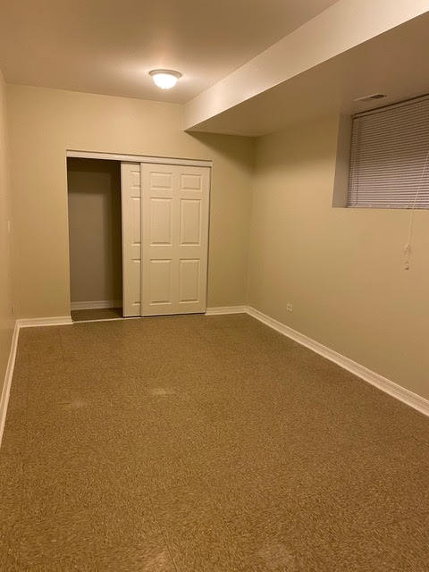 2931 North Rutherford Avenue Chicago, IL 60634 - Photo 28 of 37 an empty room with windows