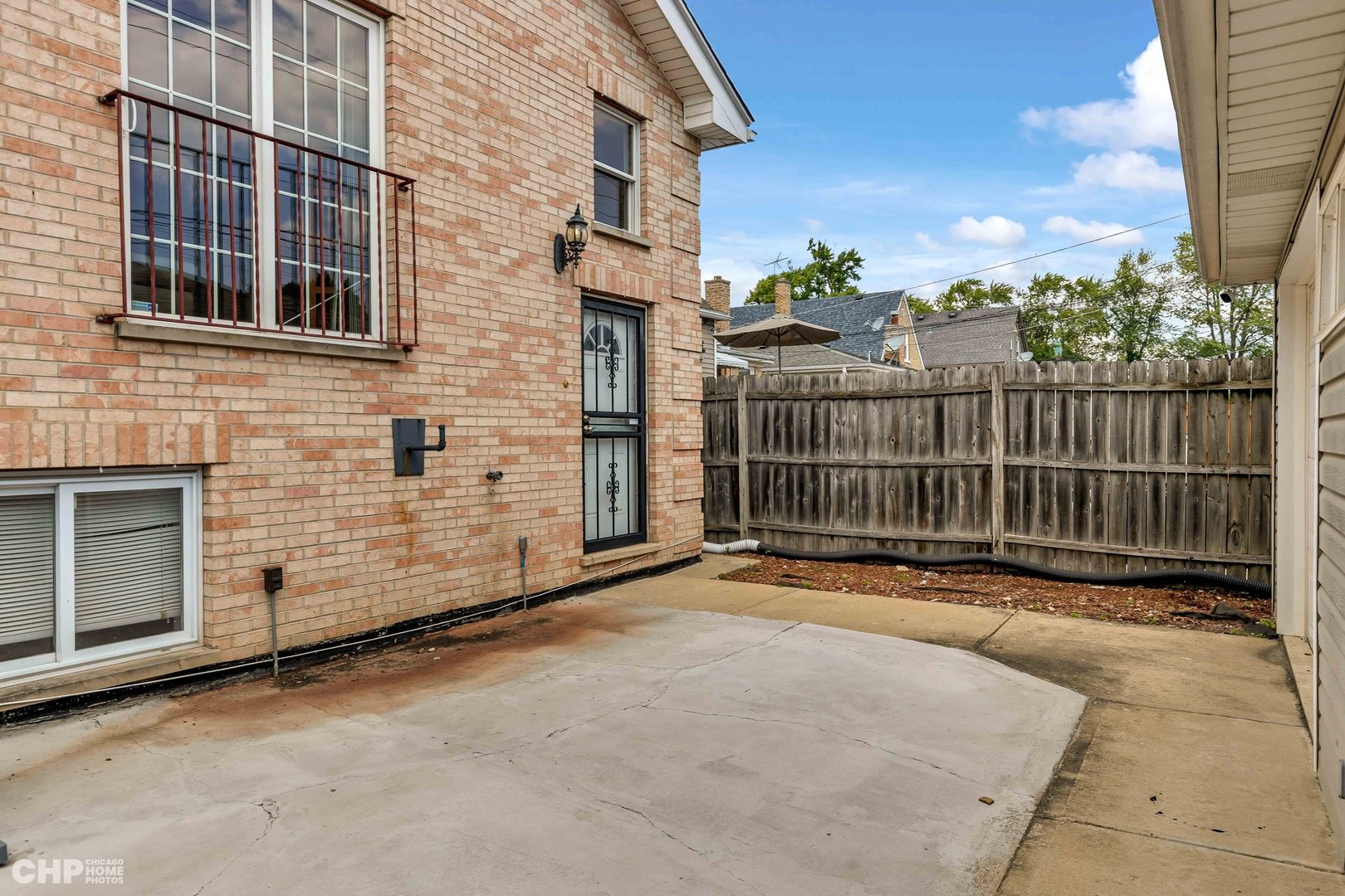 2931 North Rutherford Avenue Chicago, IL 60634 - Photo 35 of 37 a view of a house with a wooden fence