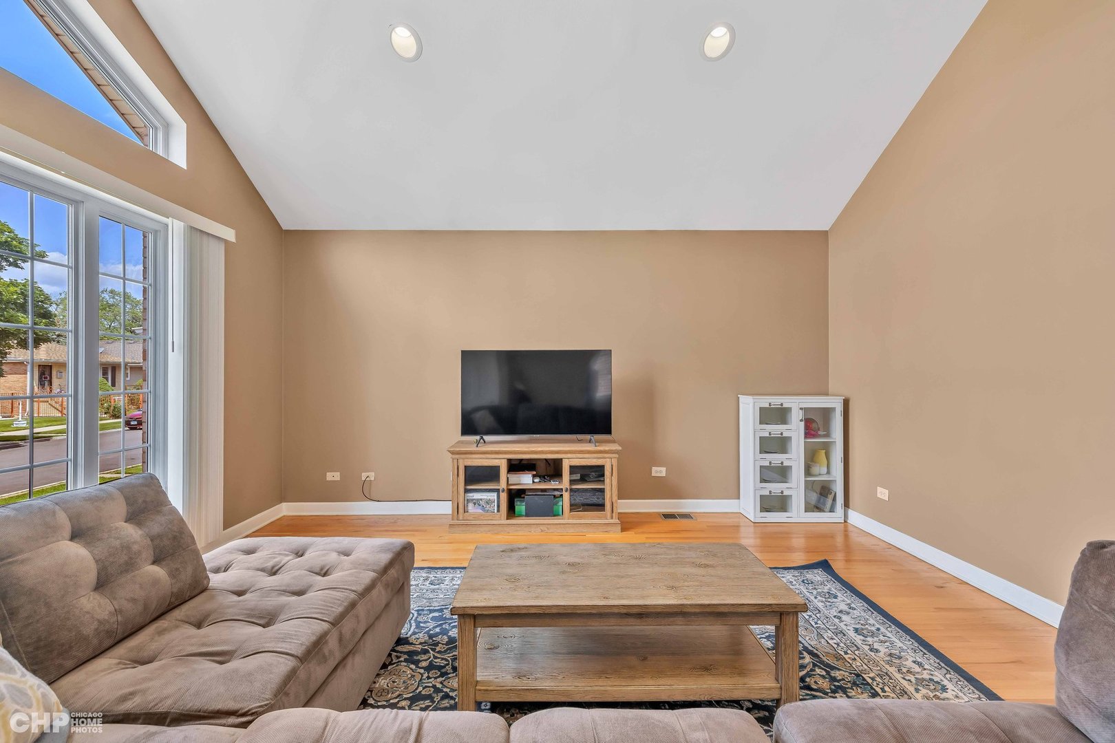 2931 North Rutherford Avenue Chicago, IL 60634 - Photo 4 of 37 a living room with furniture and a flat screen tv