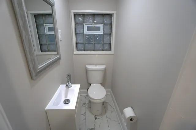 a bathroom with a toilet and a sink