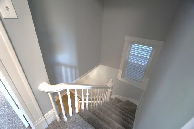 a view of an entryway with wooden floor