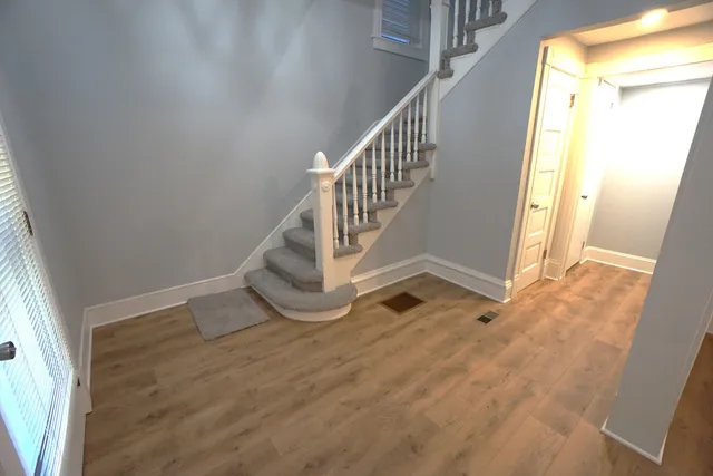 a view of entryway with wooden floor