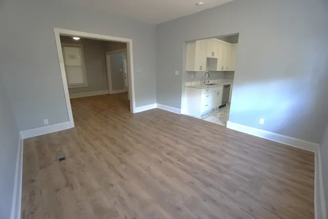 a view of a kitchen cabinets and wooden floor