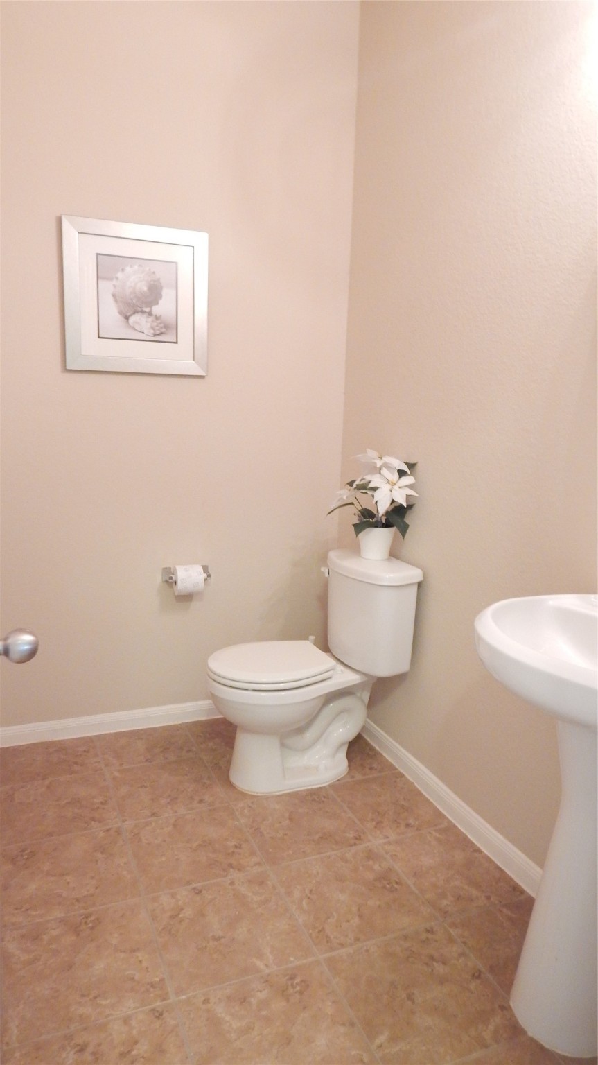 3219 Creole Bay Lane Rosenberg, TX 77471 - Photo 14 of 35 a white toilet sitting next to a bathroom sink