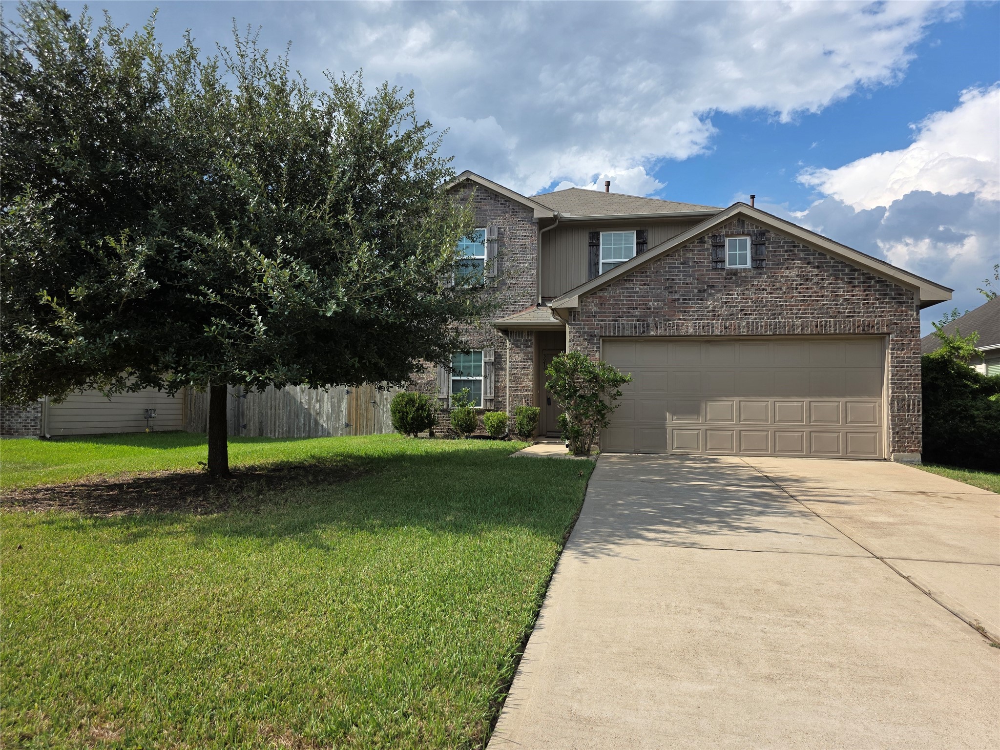 3219 Creole Bay Lane Rosenberg, TX 77471 - Photo 2 of 35 a front view of a house with a garden and yard