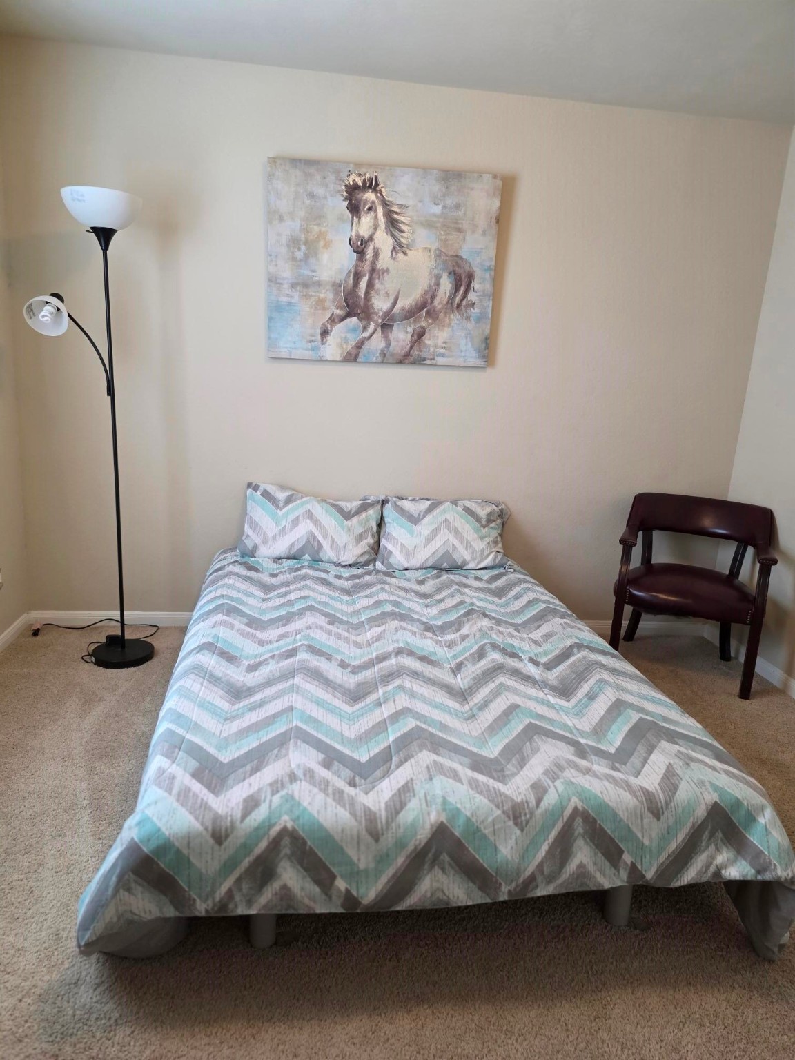 3219 Creole Bay Lane Rosenberg, TX 77471 - Photo 21 of 35 a bedroom with bed and painting on the wall