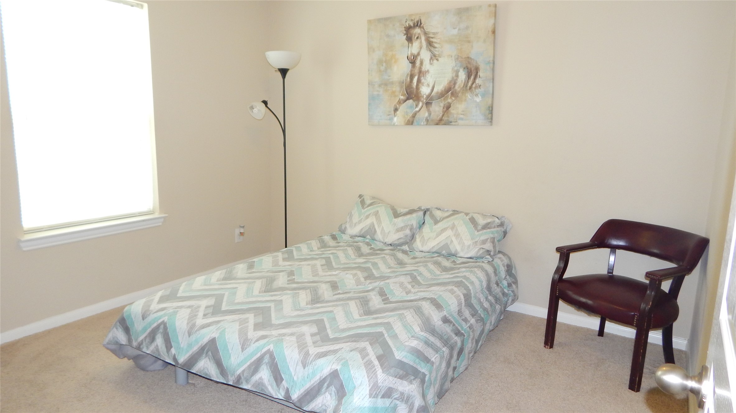 3219 Creole Bay Lane Rosenberg, TX 77471 - Photo 22 of 35 a bedroom with a bed and a chair