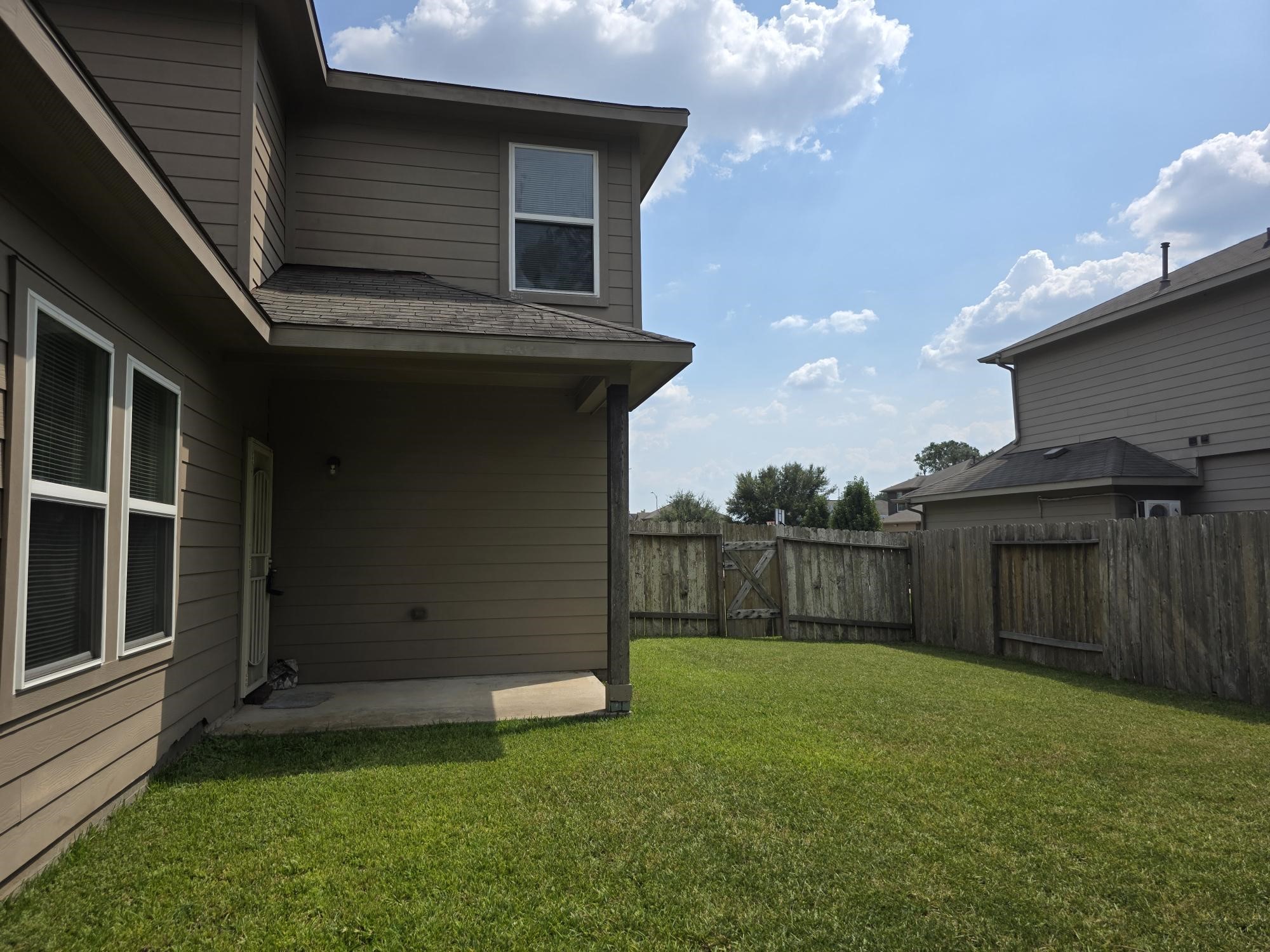 3219 Creole Bay Lane Rosenberg, TX 77471 - Photo 26 of 35 a view of a backyard with a cabin