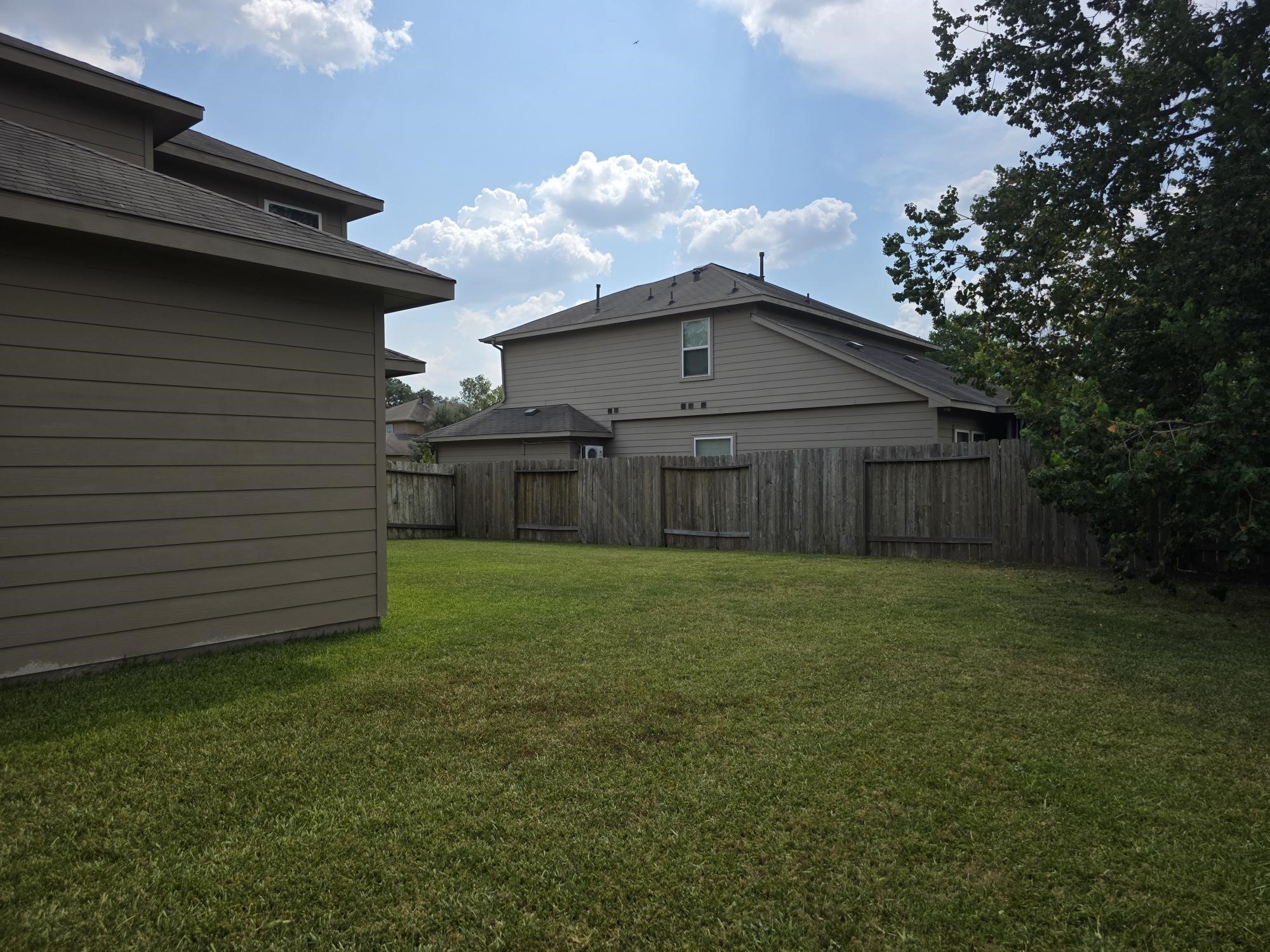 3219 Creole Bay Lane Rosenberg, TX 77471 - Photo 27 of 35 a view of a backyard with a garden