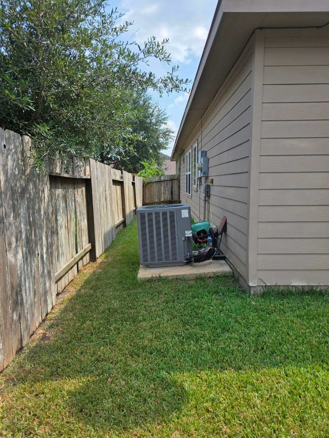 3219 Creole Bay Lane Rosenberg, TX 77471 - Photo 33 of 35 a view of backyard with barbeque grill and wooden fence