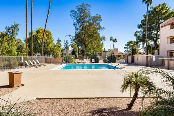 a view of a water fountain and a fountain in the middle of a yard