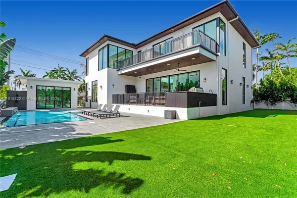a front view of house with yard and outdoor seating