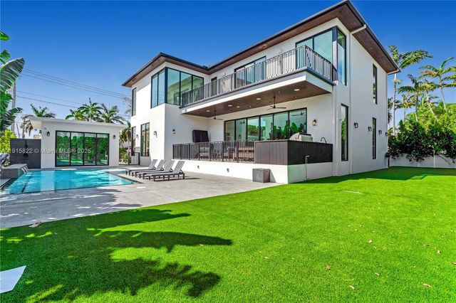 a front view of house with yard and outdoor seating