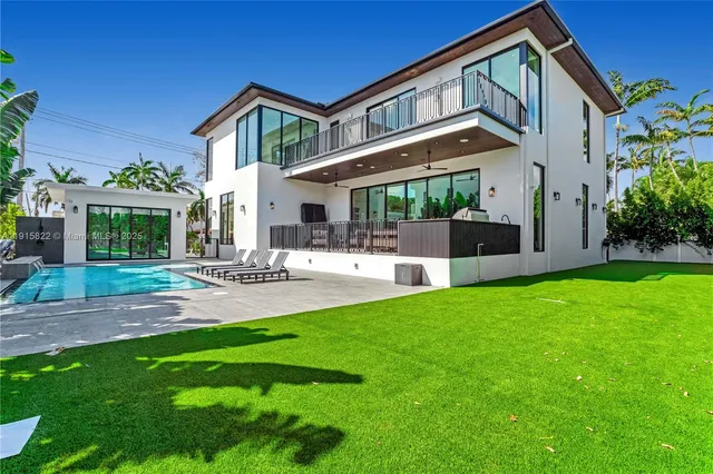 a front view of house with yard and outdoor seating
