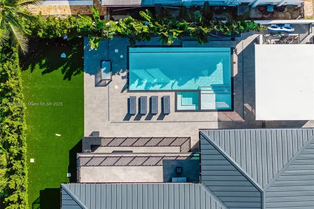 a view of a house with a yard and a garden