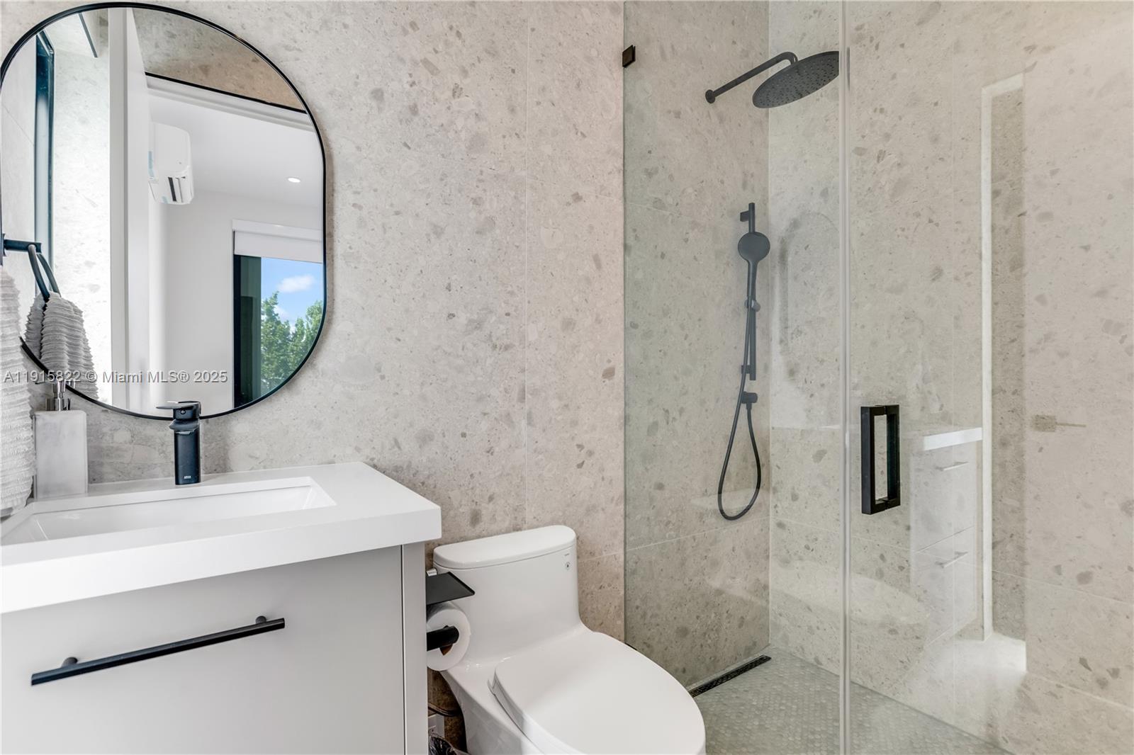 9045 Hawthorne Avenue Surfside, FL 33154 - Photo 22 of 61 a bathroom with a toilet sink and shower