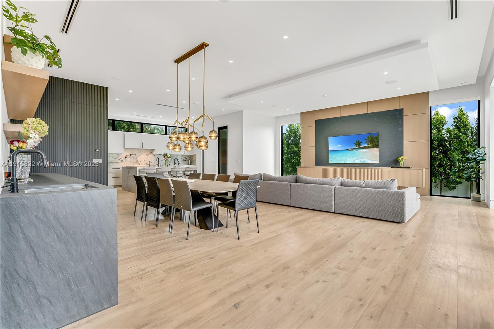 9045 Hawthorne Avenue Surfside, FL 33154 - Photo 23 of 61 a living room with furniture and a large window