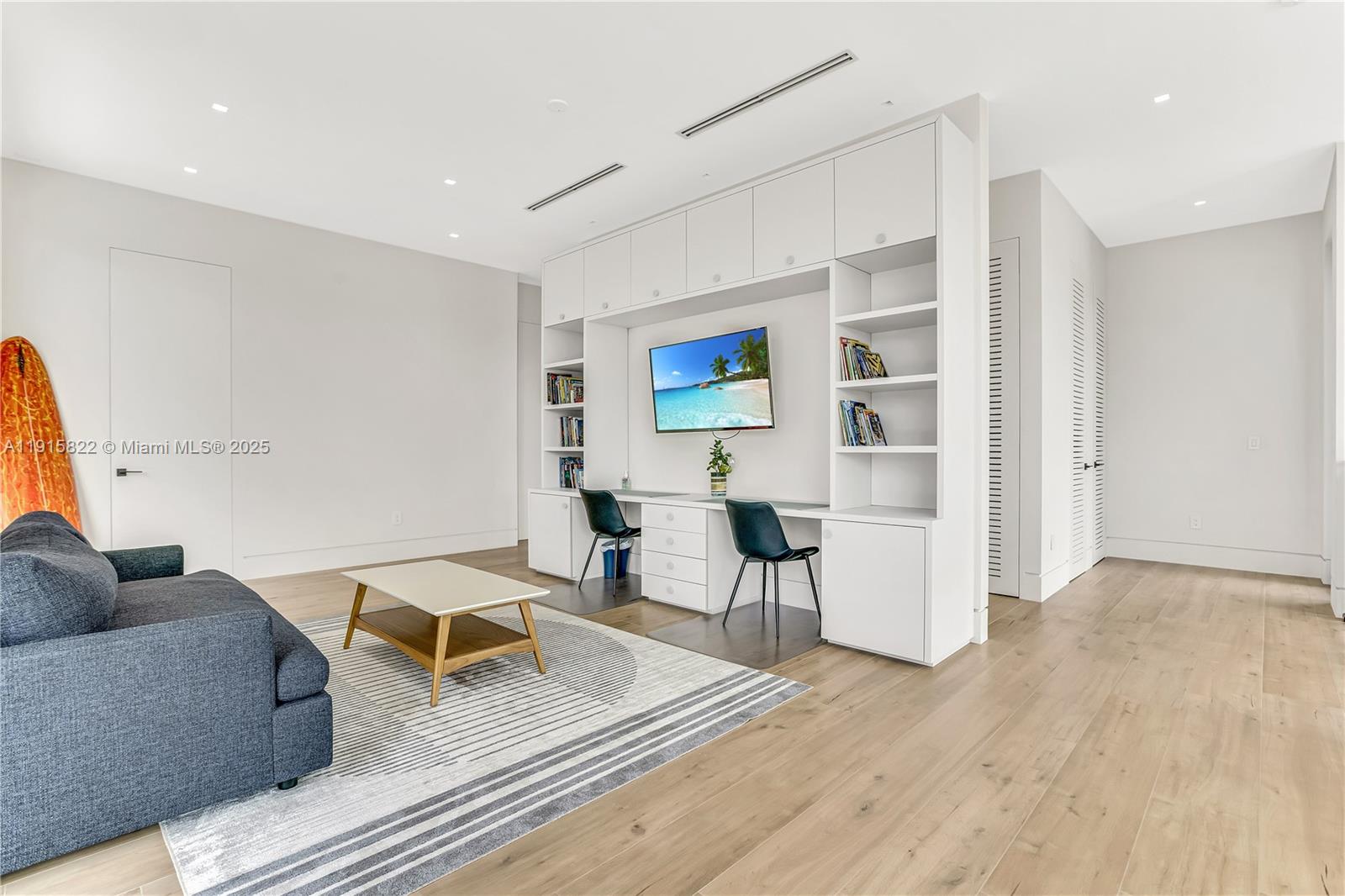 9045 Hawthorne Avenue Surfside, FL 33154 - Photo 37 of 61 a living room with furniture and wooden floor