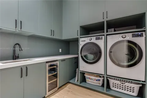 a bedroom with a bed and a large mirror