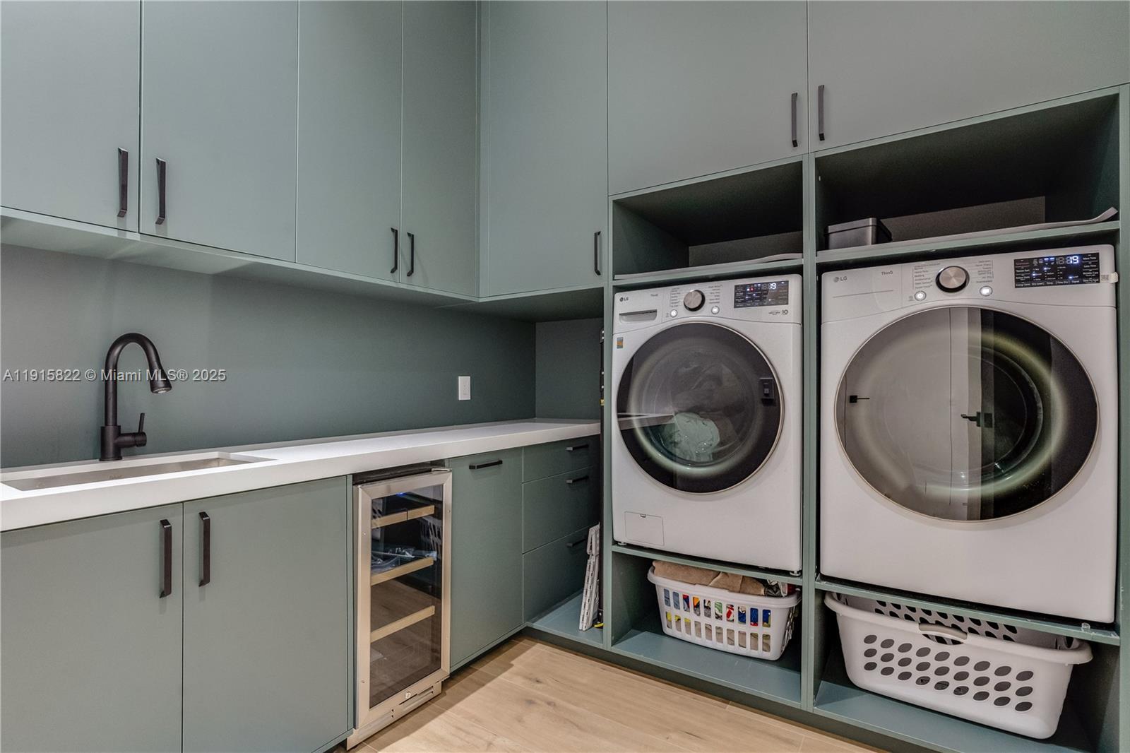9045 Hawthorne Avenue Surfside, FL 33154 - Photo 39 of 61 a utility room with sink dryer and washer