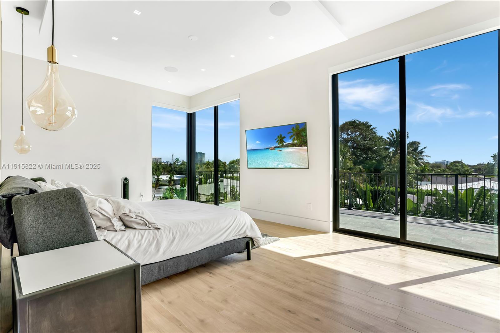 9045 Hawthorne Avenue Surfside, FL 33154 - Photo 46 of 61 a bedroom with a bed and a large window