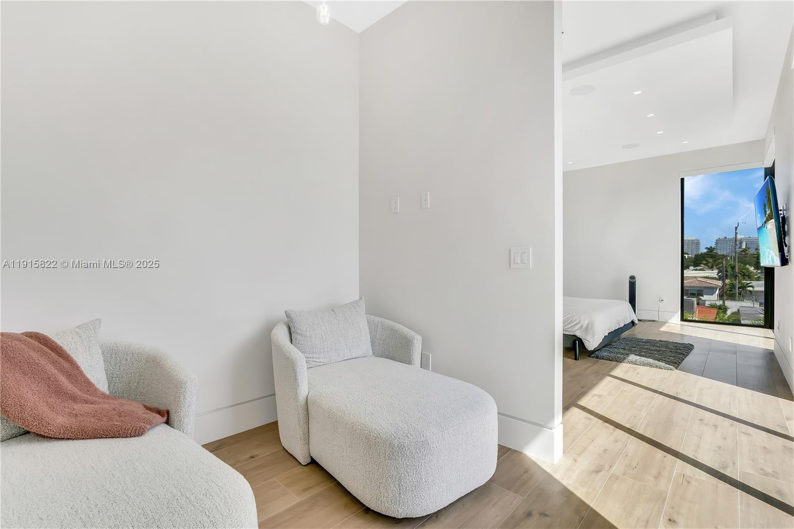 9045 Hawthorne Avenue Surfside, FL 33154 - Photo 48 of 61 a living room with furniture and a couch
