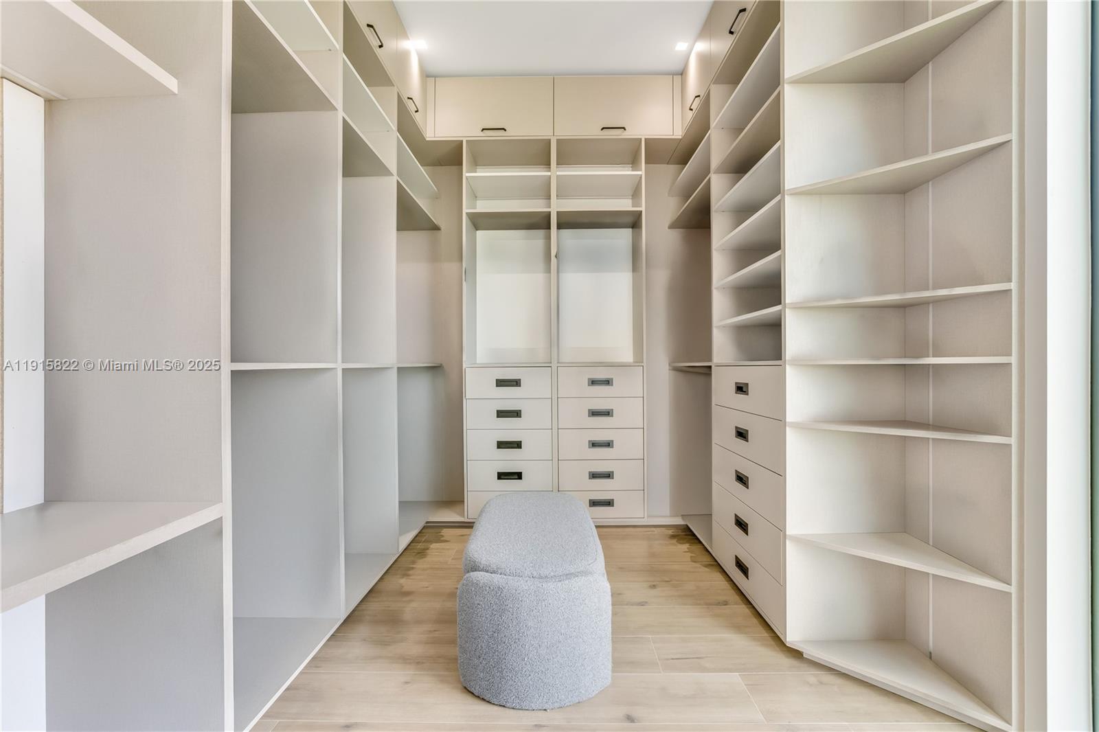 9045 Hawthorne Avenue Surfside, FL 33154 - Photo 50 of 61 a view of walk in closet with empty racks