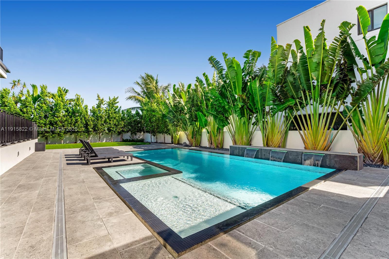 9045 Hawthorne Avenue Surfside, FL 33154 - Photo 5 of 61 a view of a backyard with plants and a patio