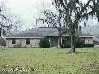 1203 Hatcher Road Middleburg, FL 32068 - Photo 1 of 1 a view of a house with a yard