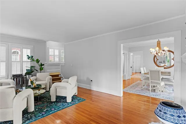 a living room with furniture and a table