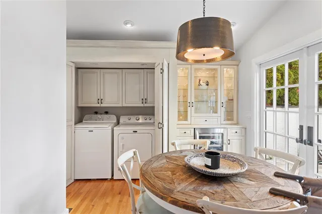 a view of a dining room with furniture and a chandelier
