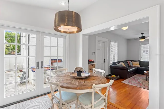 a living room with furniture a window and a table