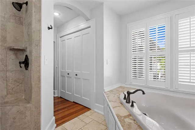 a bedroom with a bed and a table in it