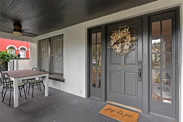 a view of a entryway door and dining room