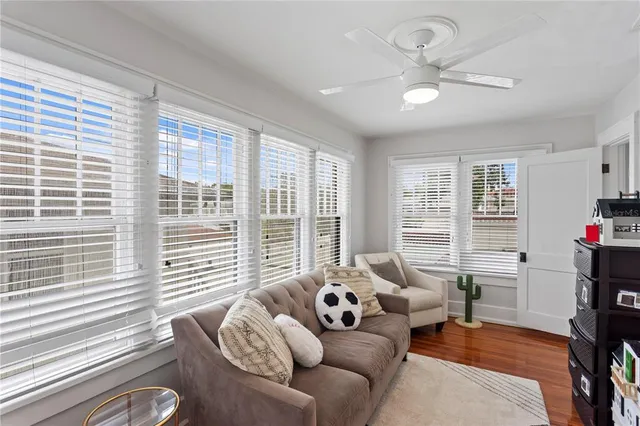 a backyard of a house with barbeque oven table and chairs