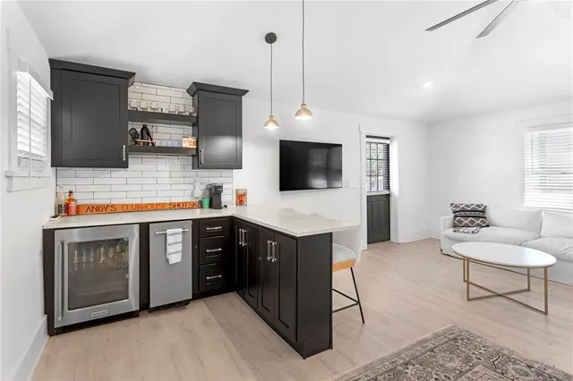 an aerial view of a house with garden space and street view