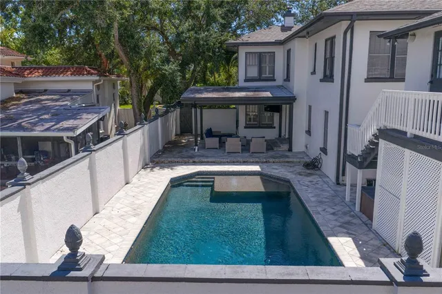 an aerial view of a house with a lake view
