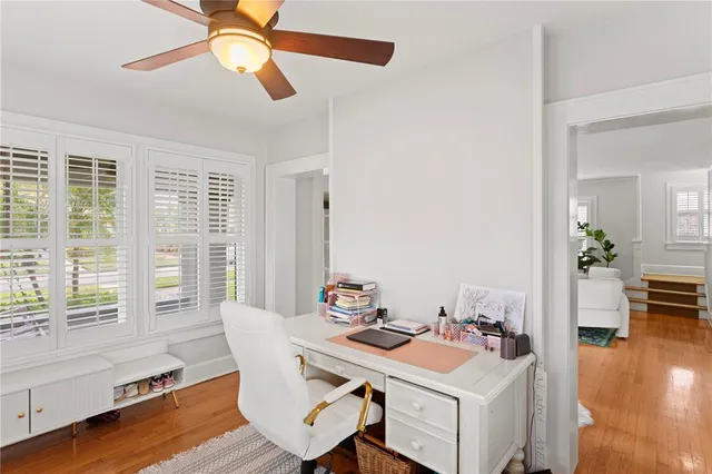 a view of a dining room with furniture window and wooden floor