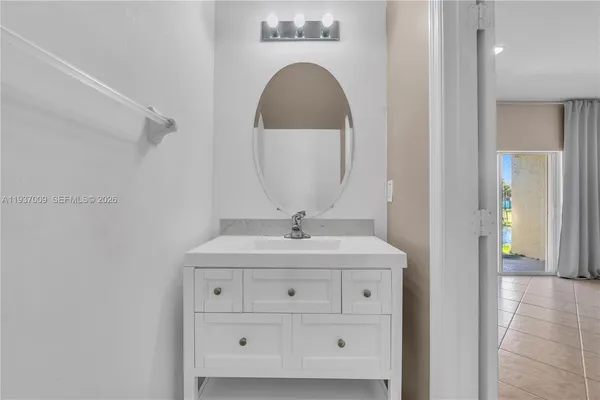 a utility room with sink dryer and washer