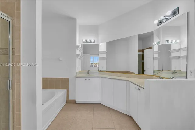 a view of an empty room with a bathroom