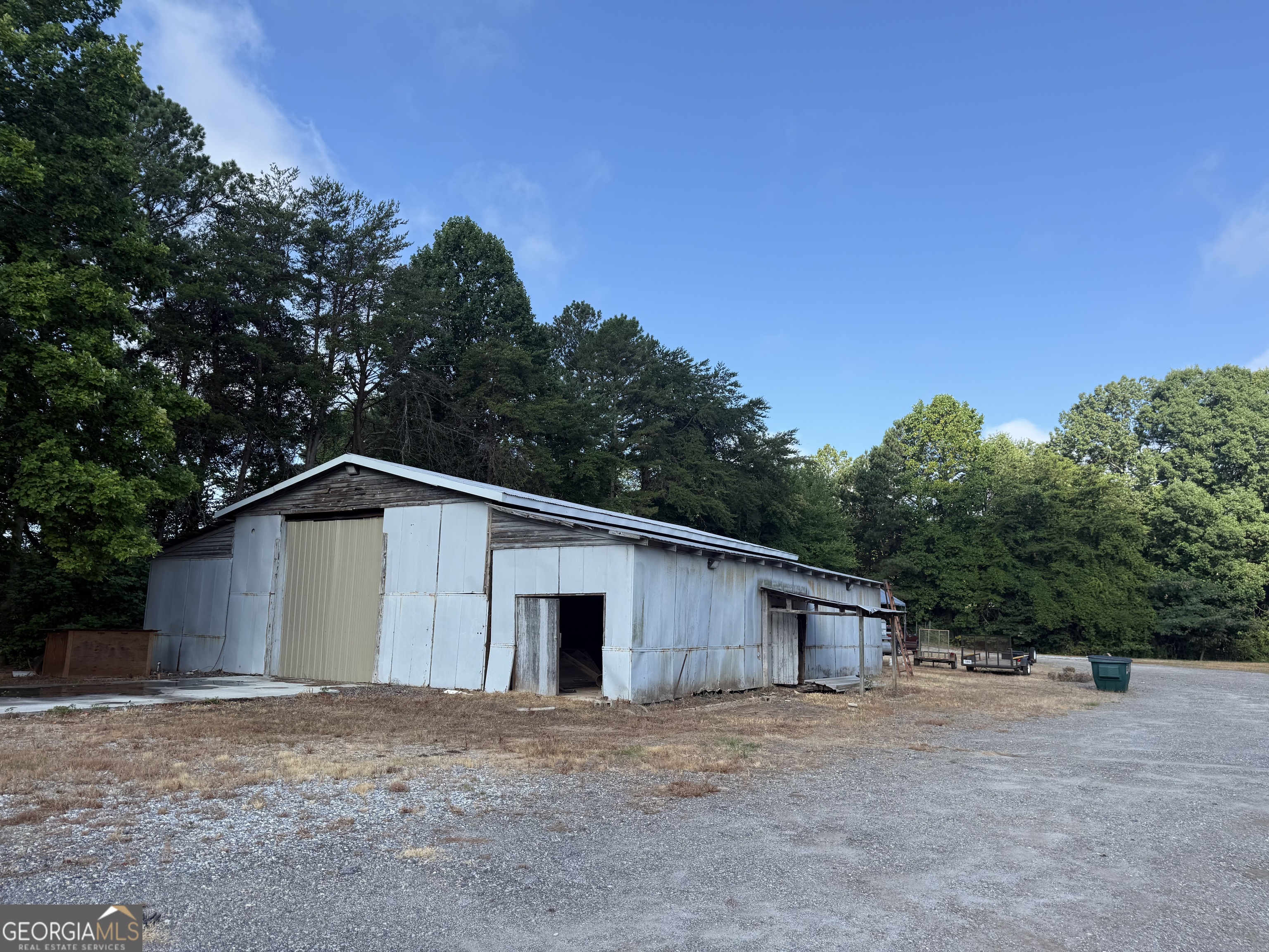 1806 Moccasin Gap Road Lula, GA 30554 - Photo 3 of 7 a big house with a big yard and large trees