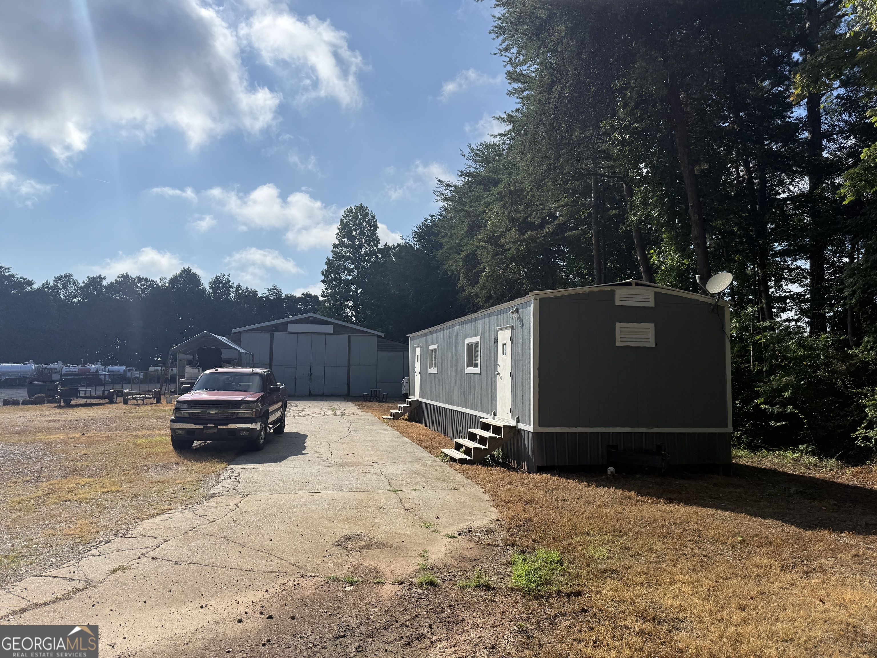 1806 Moccasin Gap Road Lula, GA 30554 - Photo 5 of 7 a car parked in front of a house