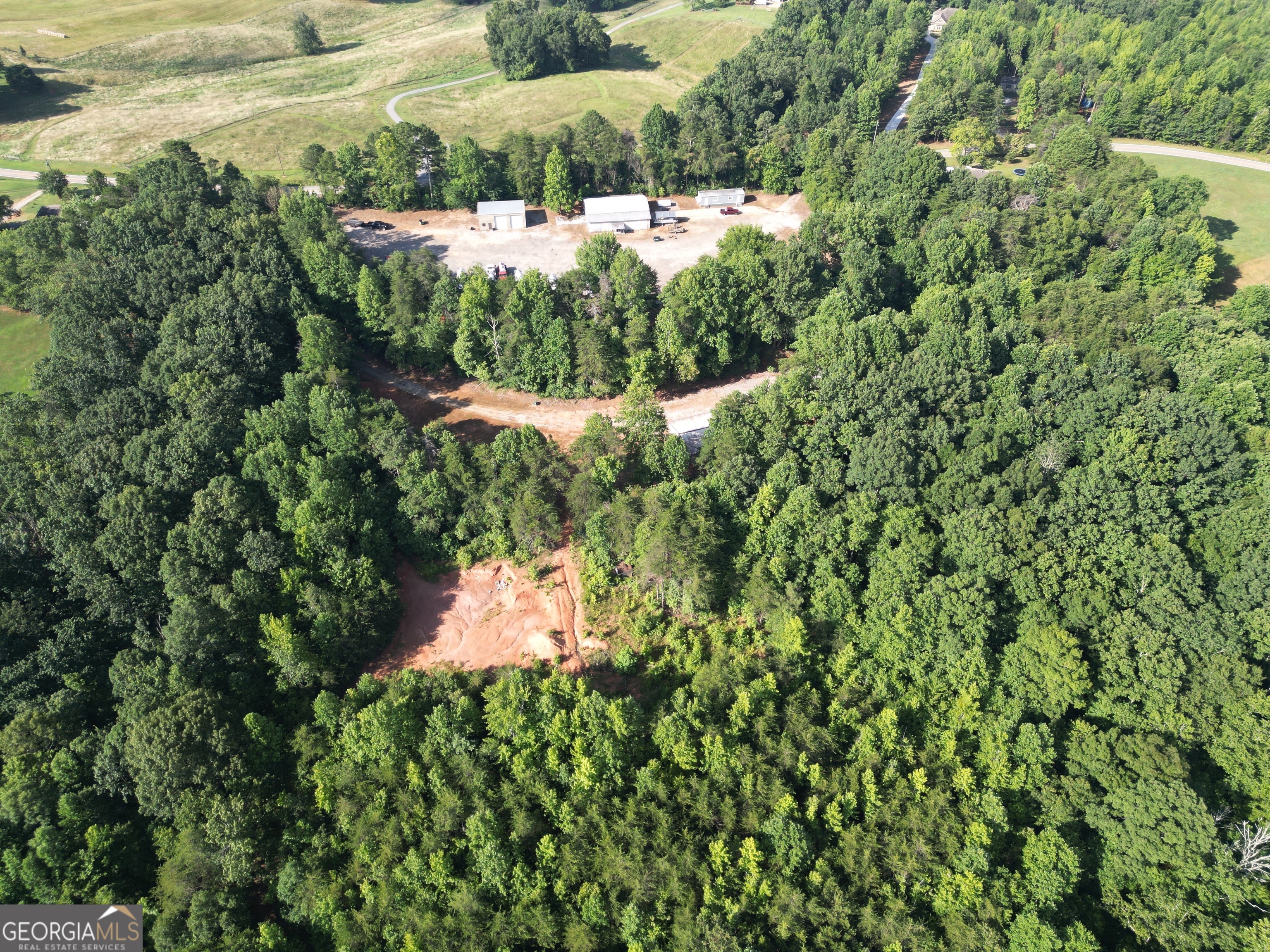 1806 Moccasin Gap Road Lula, GA 30554 - Photo 6 of 7 a view of a garden with a lake